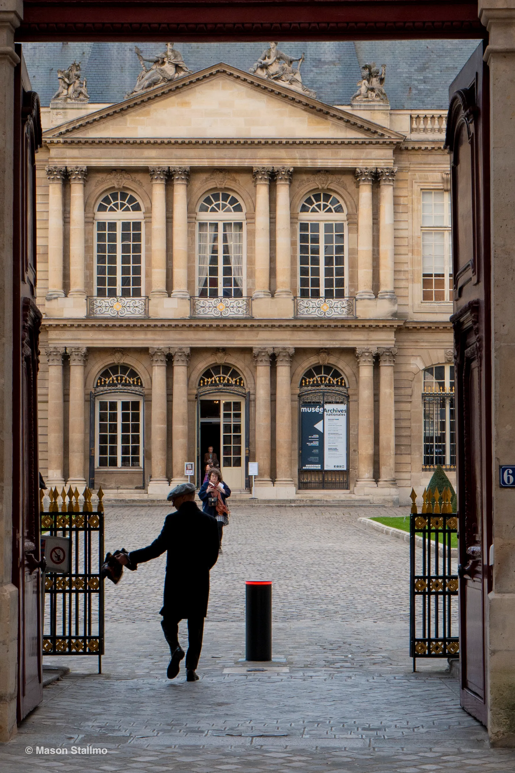 A man entering the French National Archives